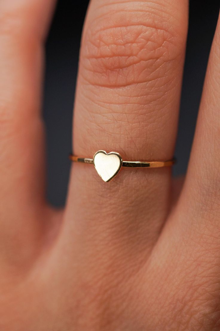 The small heart adds a lovely detail to this lightly hammered stacking ring. Each ring is handmade to order in your ring size for a perfectly customized fit. This ring makes for the perfect anniversary, birthday or valentine's day gift for your special somebody! The band measures approximately 1mm in width and features a lightly hammered finish. The Heart detail measures approximately 5mm in width. This listing is for ONE SINGLE Heart Ring in 14K GOLD FILL metal.  This ring is a great alternativ Finish The Heart, Love Valentines Day, Minimal Ring, Tiny Rings, Free Love, Hammered Band, Ring Stacking, Mini Heart, Small Heart