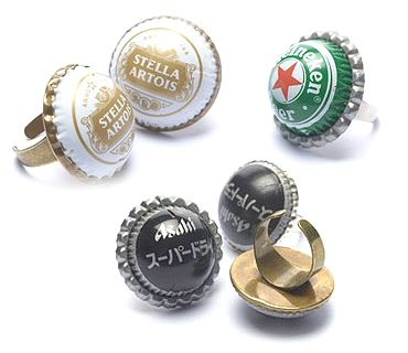 six bottle caps with different designs and sizes are shown in various colors, shapes and sizes