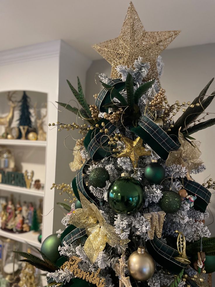 a christmas tree decorated with green and gold ornaments