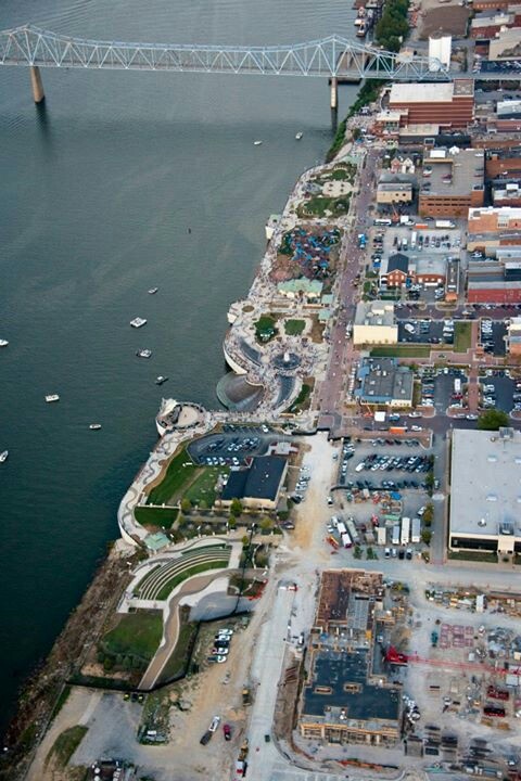 an aerial view of the city and bridge