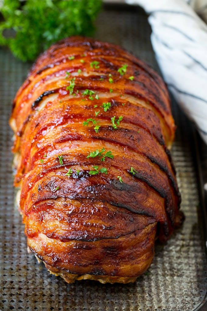 a large piece of meat sitting on top of a pan