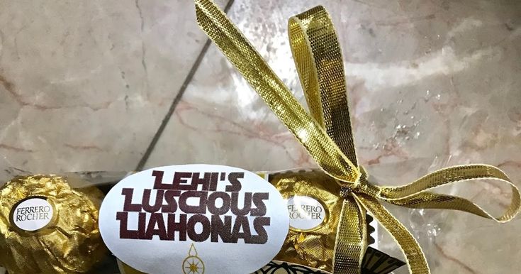 a chocolate bar wrapped in gold foil and tied with a ribbon that says let's ludicious lahoma