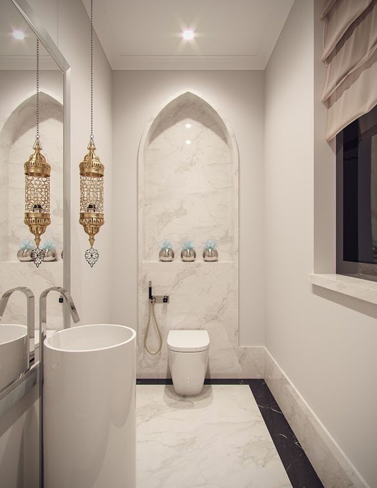 a bathroom with white walls and marble floors