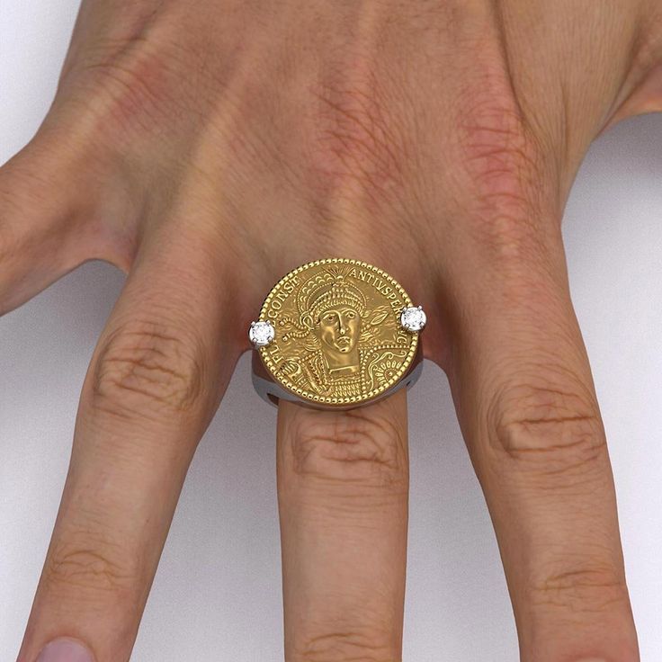 Ancient Roman Style Gold Coin Ring in 18k or 14k white and yellow gold, made in Italy.Discover the exquisite craftsmanship of our Made in Italy men's gold ring, available in 14k or 18k gold. This stunning piece features a meticulously reproduced Roman AV Solidus of Emperor Constantius II (337-361 AD). Adorned with the noble figure of Flavius Julius Constantius, wearing a diadem, helmet, and cuirass, the intricate details showcase his pious and blessed august status. Holding a spear and a shield