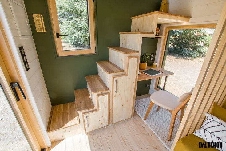 the interior of a tiny house with stairs