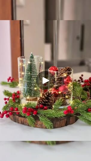 the table is decorated with pine cones and evergreens