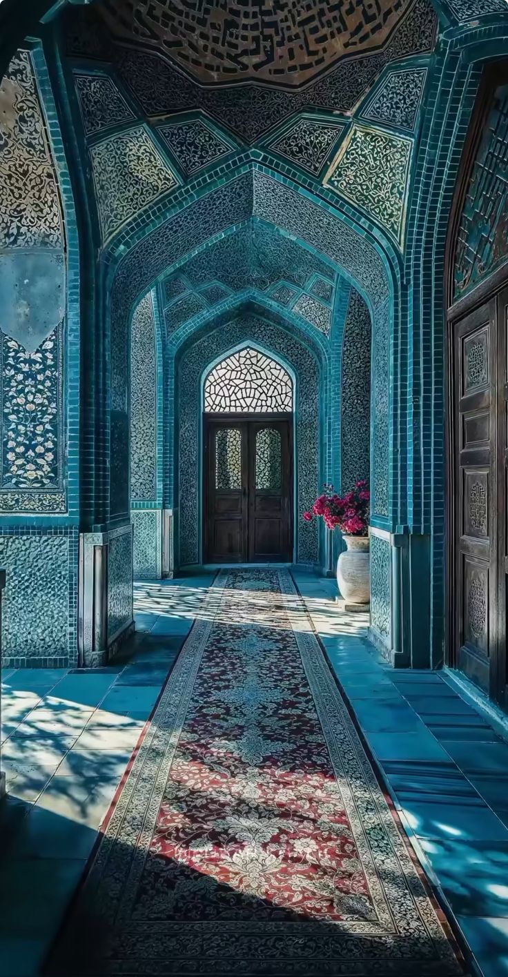 an ornate hallway with blue walls and doors