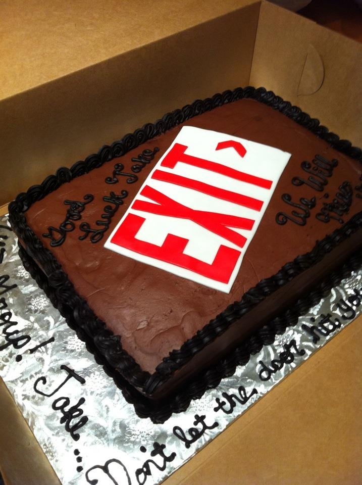 a cake in a box with the word sale on it and an ey logo