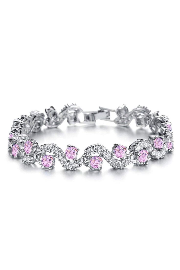 I jewels gives you new look, made of high quality material(s). The stones used are kundans which gives classy look and the alloy used is led free. Ideally suited for party as well as casual wear and perfect gift for yourself or your loved ones. I jewels presents this beautiful bracelet which is light in weight.  Product Features:   Color: Pink Material: Alloy Occasion: Wedding Disclaimer: There will be slight difference in digital to actual image Metal Crystal Bracelet For Party, Metal Crystal Bracelet For Parties, Trendy Jeweled Jewelry Perfect As A Gift, Trendy Silver Wedding Bracelet, Trendy Silver Bracelet For Wedding, Trendy Cubic Zirconia Wedding Jewelry, Gift Jewelry With Jeweled Alloy, Gift Jeweled Alloy Jewelry, Crystal Round Tennis Bracelet For Party