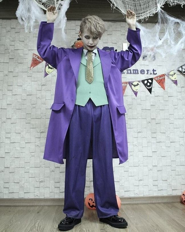 a man dressed up as the joker for halloween