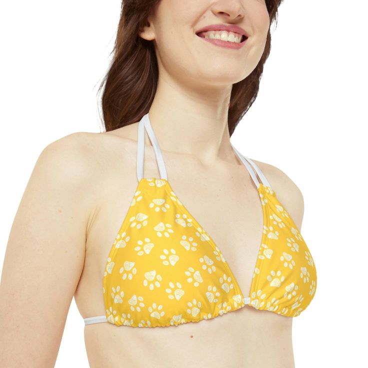 Made with 4-way stretch Tricot (82% Microfiber, 18% Spandex), this Goldenpaw Strappy Bikini Set is the perfect companion to all summer escapades. With adjustable elastic straps for a perfect fit, this complete two-piece swimsuit will become an instant summer hit. .: Material: 82% microfiber polyester, 18% spandex.: Medium fabric (7.5 oz /yd² (250 g/m²)).: Two piece swimsuit .: Adjustable elastic straps.: Removable cups.: Assembled in the USA from globally sourced parts.: Seam thread color automa Casual Strappy Swimwear For Sunbathing, Adjustable Summer Tankini For Swimming, Strappy Swimwear With Built-in Bra, Nylon Swimwear With Straps For Spring, Nylon Halter Neck Swimwear For Spring, Adjustable Halter Top With Built-in Bra For Summer, Strappy Nylon Swimwear For Summer, Adjustable Yellow Swimwear For The Pool, Adjustable Tankini For Summer Swimming