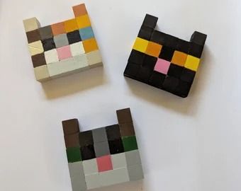 three pieces of art made out of lego blocks