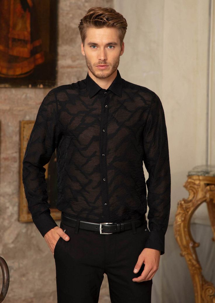 Your friends will see straight through you... partially sheer, this black Mondo shirt adds elegance and mystery that is emblematic of Mondo's freedom, empowerment and individualism Limited Edition Sheer custom fabric Semi-see through Custom metal square button French placket Button-down collar Long sleeves with rounded, single-button cuffs Rounded hem Cotton Dry clean suggested Classic Sheer Tops For Formal Occasions, Classic Sheer Top For Formal Occasions, Designer Long Sleeve Shirt For Party, Designer Black Shirt With Spread Collar, Black Sheer Long Sleeve Shirt, Designer Black Sheer Top, Designer Black Shirt With Button Closure, Designer Fitted Button-up Shirt, Designer Black Shirt For Business