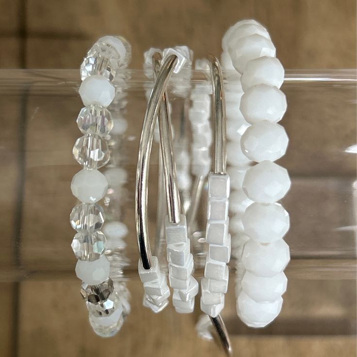 Add some pizzazz with this playful Bright White Wrap Bracelet Stack. The stack features a bright white base that can be dressed up or down. Mix in any color for a whole new look. Say goodbye to dull accessories and hello to a little bit of fun! HOC-winter White Adjustable Wrap Bracelet For Gift, Adjustable White Wrap Bracelet Gift, White Beaded Bangle Bracelets For Party, Flexible White Beaded Stretch Bracelet, Modern Adjustable Beaded Bracelets For Party, Trendy White Beaded Bracelets For Party, White Adjustable Wrap Bracelet, Adjustable White Stretch Bracelet For Party, Everyday White Beaded Wrap Bracelet