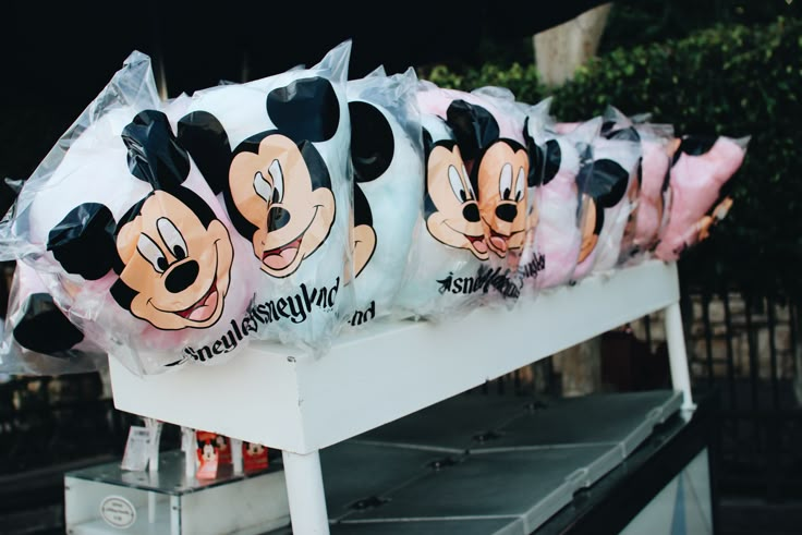 there are many bags with mickey mouse faces on them