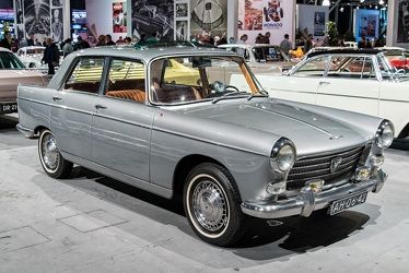 an old car is on display in a showroom