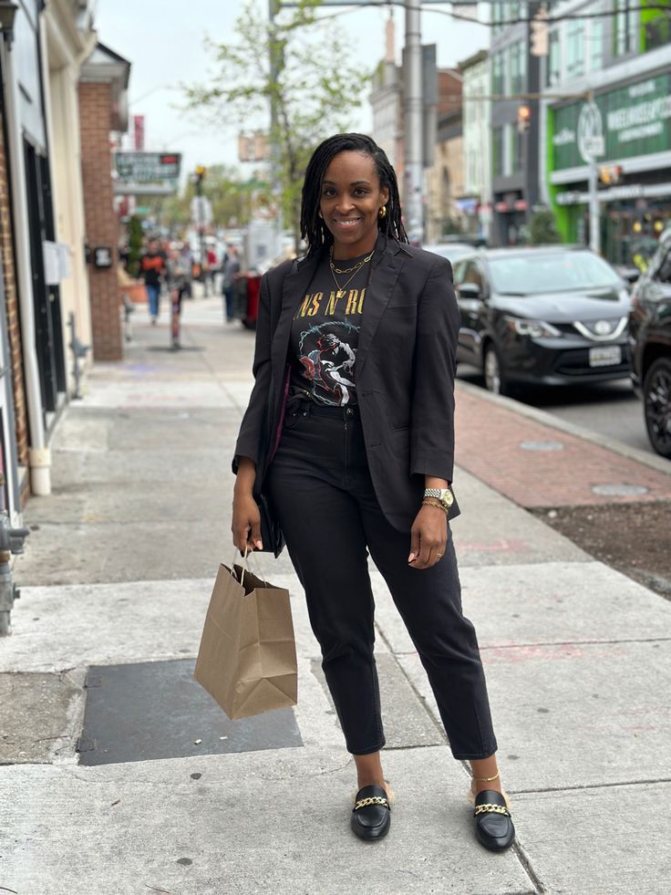 I love these @stevemadden mules and this @target graphic tee paired with a black blazer. Elevate it with some gold jewelry 🙌🏾❤️ Tshirt With Slacks, Black Blazer Graphic Tee Outfit, Graphic T Shirt With Blazer Outfit Women, Graphic Tee And Slacks Outfit, Graphic Tee With Blazer, Graphic Tee Work Outfit, Blazer With Tshirt, Black Graphic Tee Outfit, Mock Neck Top Outfit