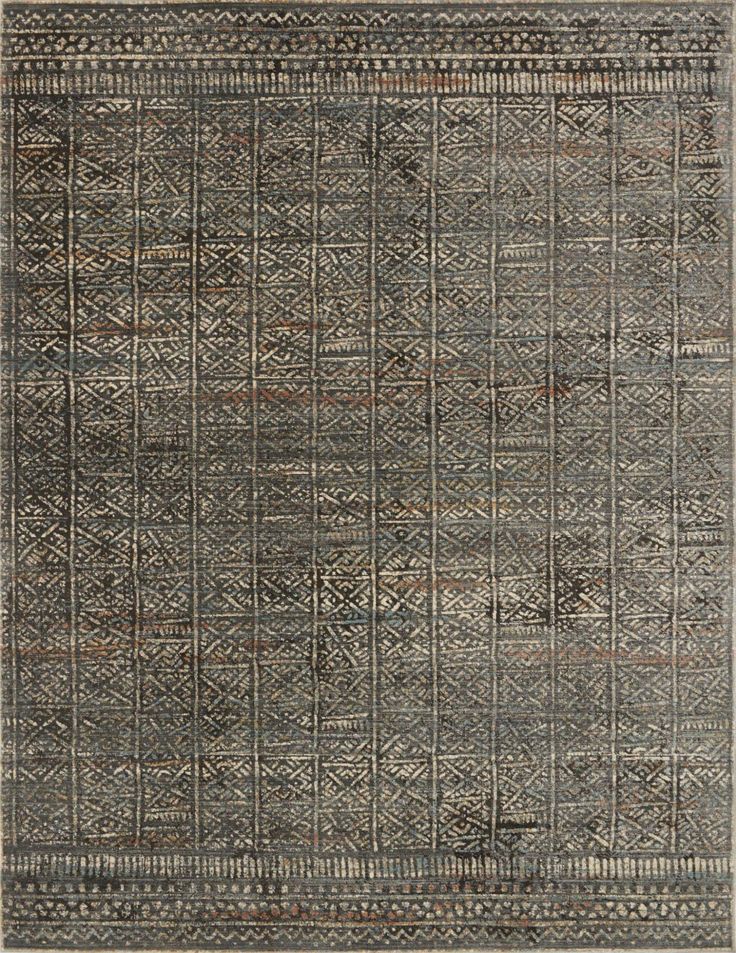 a gray rug with an intricate design on the front and back side, in grey tones