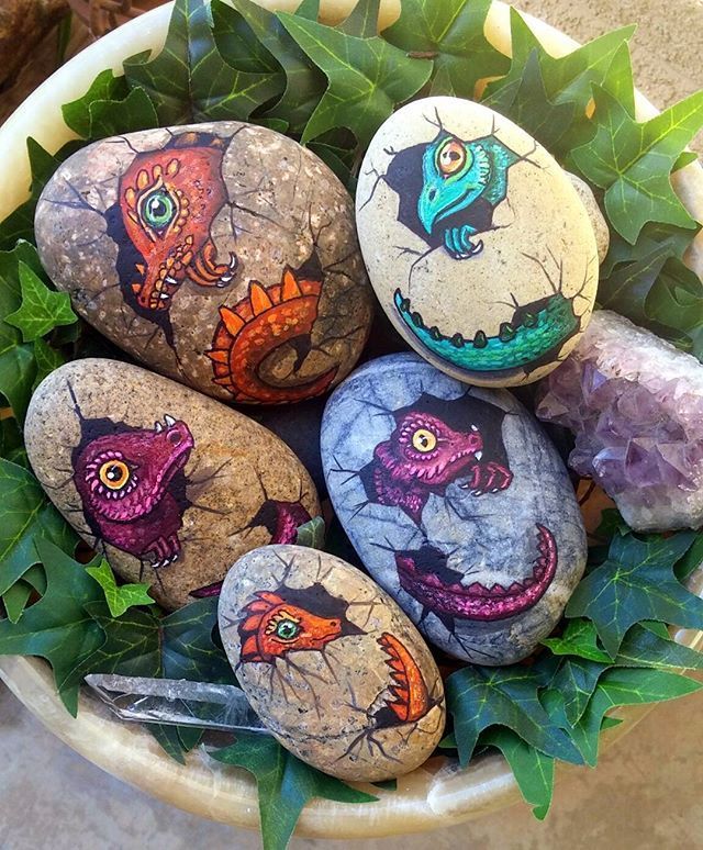 some rocks are sitting in a planter with plants on them and the words instagram com above it