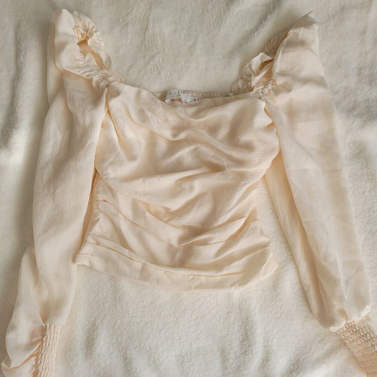 Great Condition Never Worn Just Took Tags Off Slightly Slim Fit, More Like An Xs Elegant Cream Crop Top For Spring, Elegant Cropped Cream Top, Elegant Cream Cropped Tops, Fitted Beige Ruched Blouse, Feminine Cropped Ruched Tops, Fitted Ruched Beige Blouse, Feminine Ruched Cropped Tops, Chic Cream Cropped Blouse, Feminine Beige Crop Top For Spring