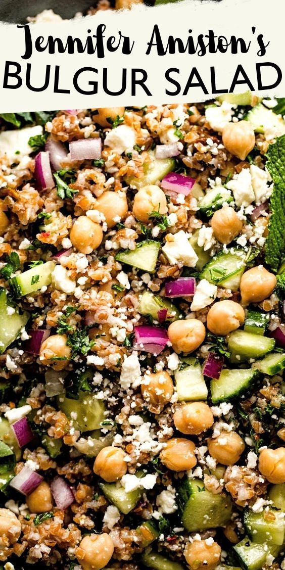 a salad with chickpeas, cucumber and feta cheese on top