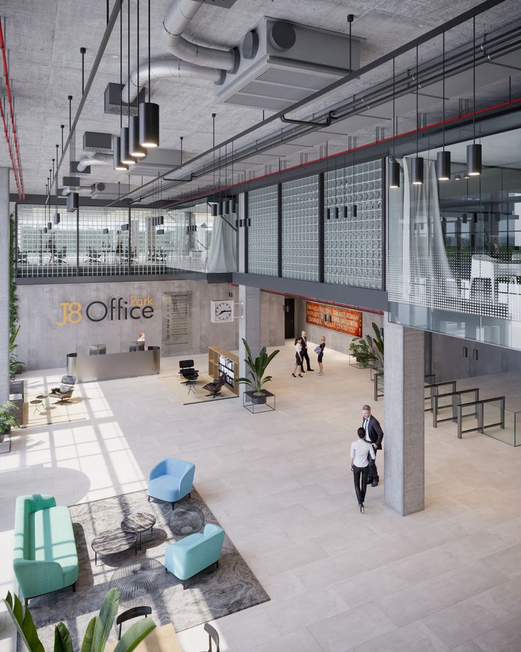 an office building with people walking around the lobby and sitting at tables in front of them