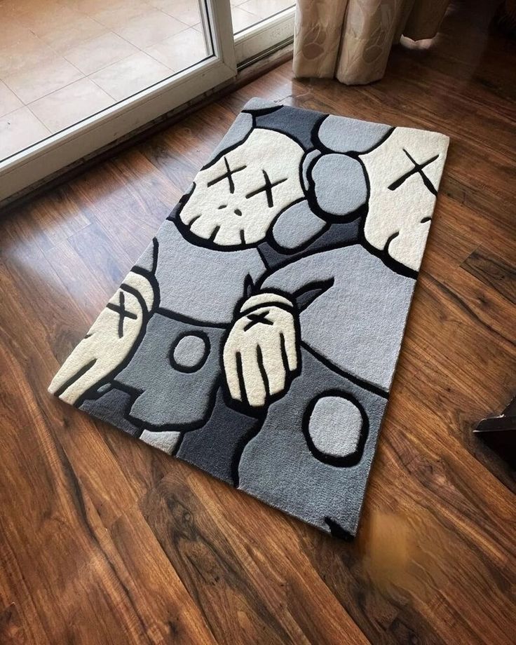 a large rug on the floor in front of a door with an image of a cartoon character