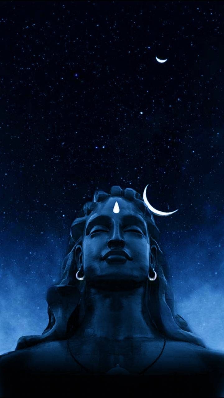 an image of a buddha statue under the night sky with moon and stars above it