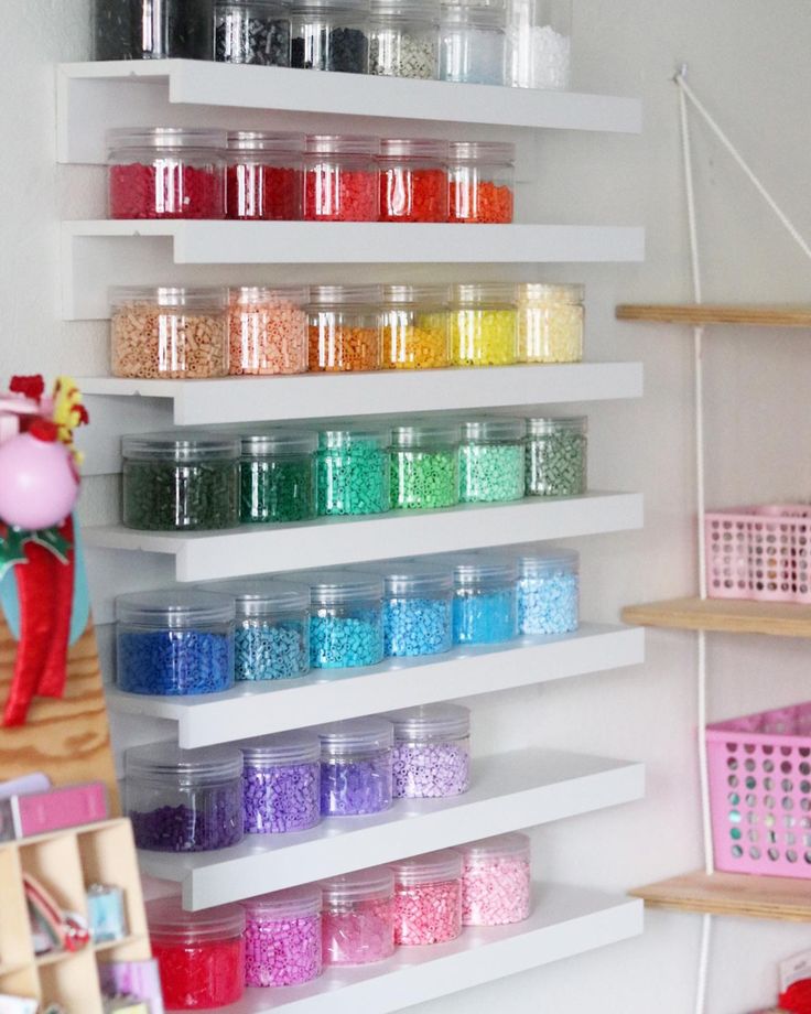 the shelves are filled with many different colored sprinkles and other craft supplies