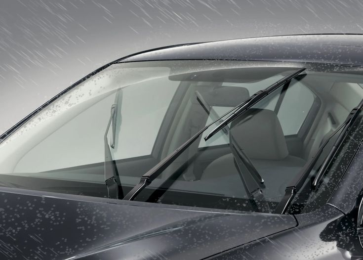 a black car parked in the rain with it's door open and windshield up