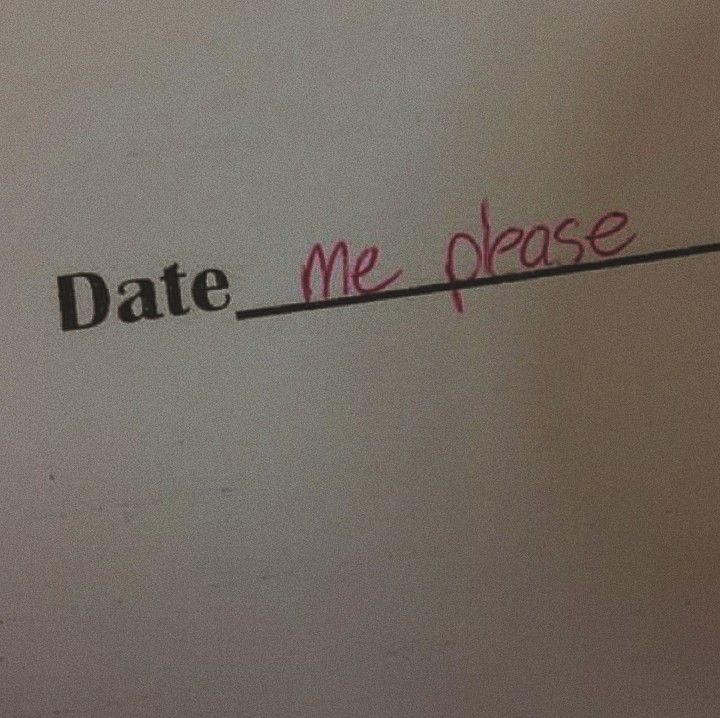 the word date me please written in red ink on a white paper with black writing