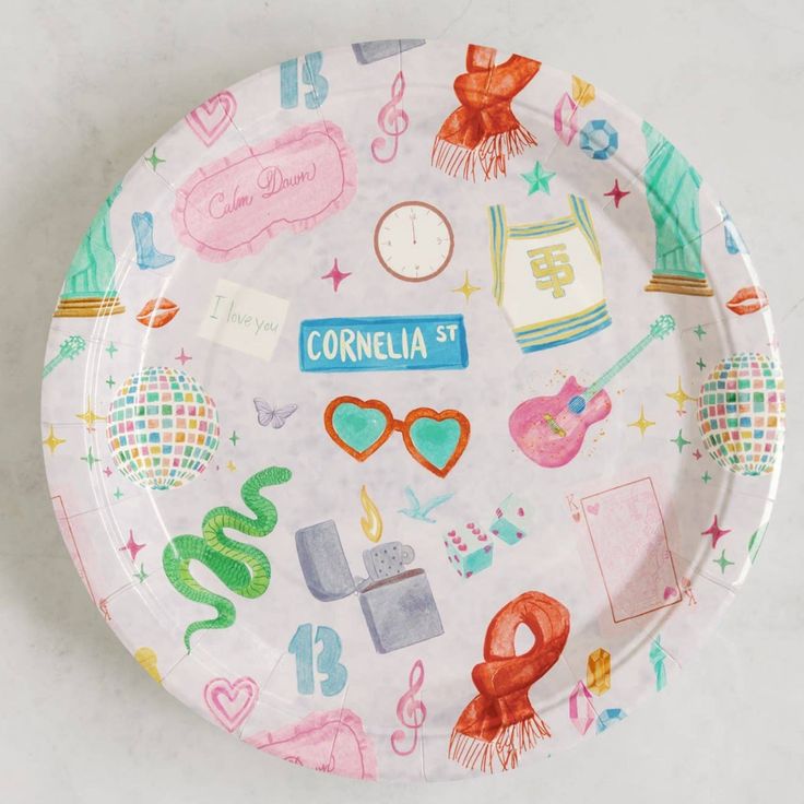 a paper plate with various items on it and the words cornella st written in blue