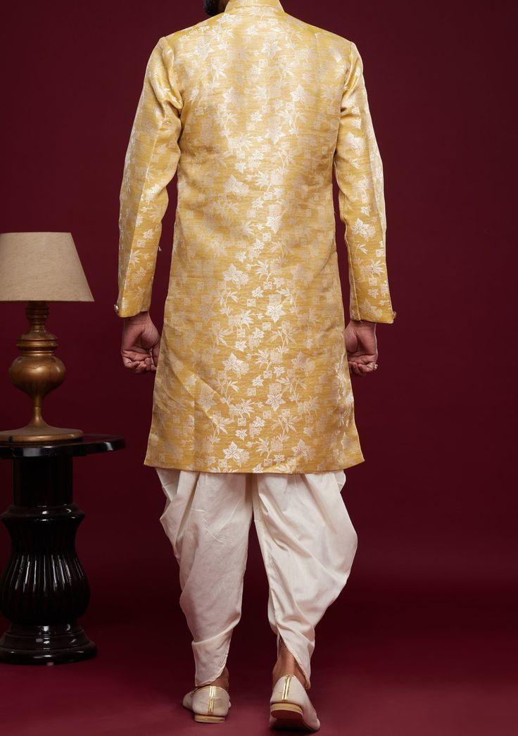 Ready-Made Sherwani With Peshawari Trouser. All Over Jacquard Brocade Style Fabric Top. Art Silk Peshawari Ready Made Trouser. Crafted in Chinese Collar Neck, and Full Sleeve. Satin Lining with Plain Work. High-Quality Matching Buttons. Please Note: The footwear shown in the picture is for presentation and photography purpose only. Color: There might be slight color variation due to lightings and flashes while photo shooting. The color may also vary because of different screen resolutions. Wash Semi-stitched Chanderi Bandhgala For Transitional Season, Transitional Semi-stitched Chanderi Bandhgala, Navratri Chanderi Sherwani With Straight Kurta, Art Silk Bandhgala With Chikankari Embroidery For Festive Occasion, Festive Art Silk Bandhgala With Chikankari Embroidery, Chanderi Sherwani Straight Kurta For Transitional Season, Transitional Chanderi Sherwani Straight Kurta, Traditional Drape Bandhgala In Chanderi For Eid, Chanderi Sherwani For Transitional Season