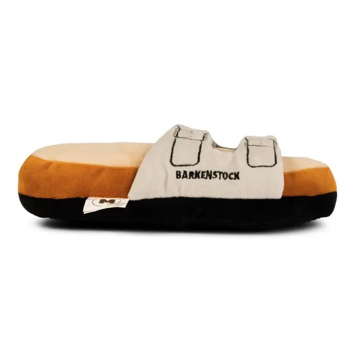 a black and white slipper with the words barkenstock on it's side