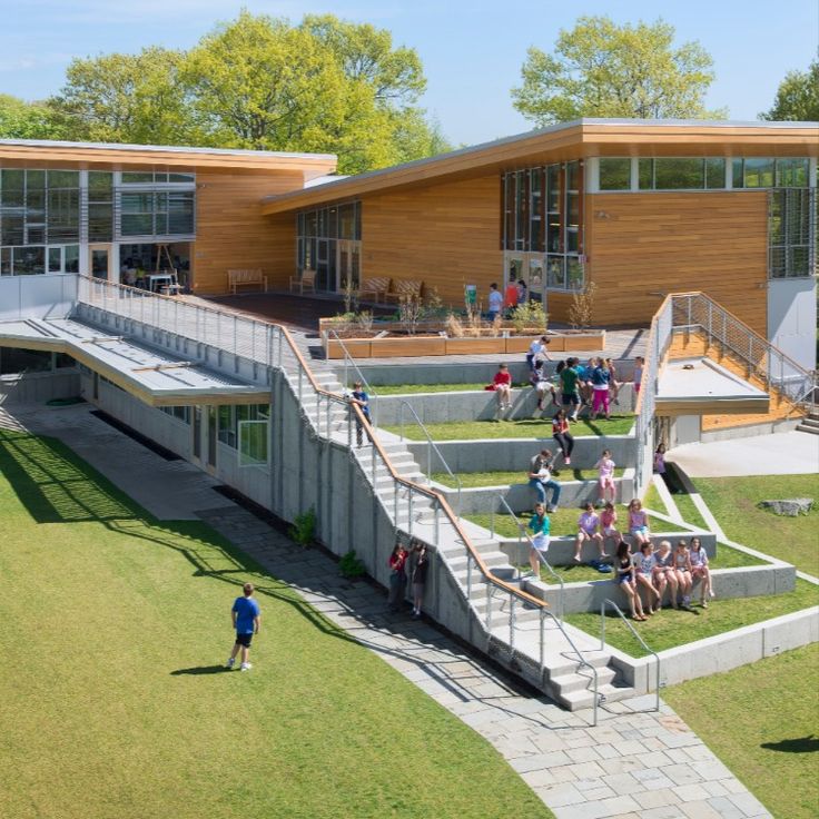 an aerial view of people walking up and down the stairs in front of a building