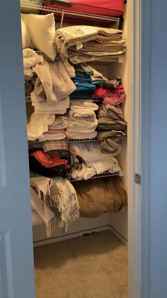 an open closet filled with lots of clothes