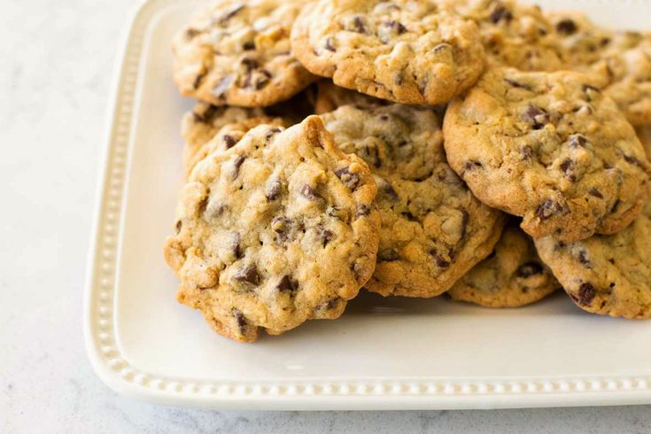 a white plate topped with chocolate chip cookies