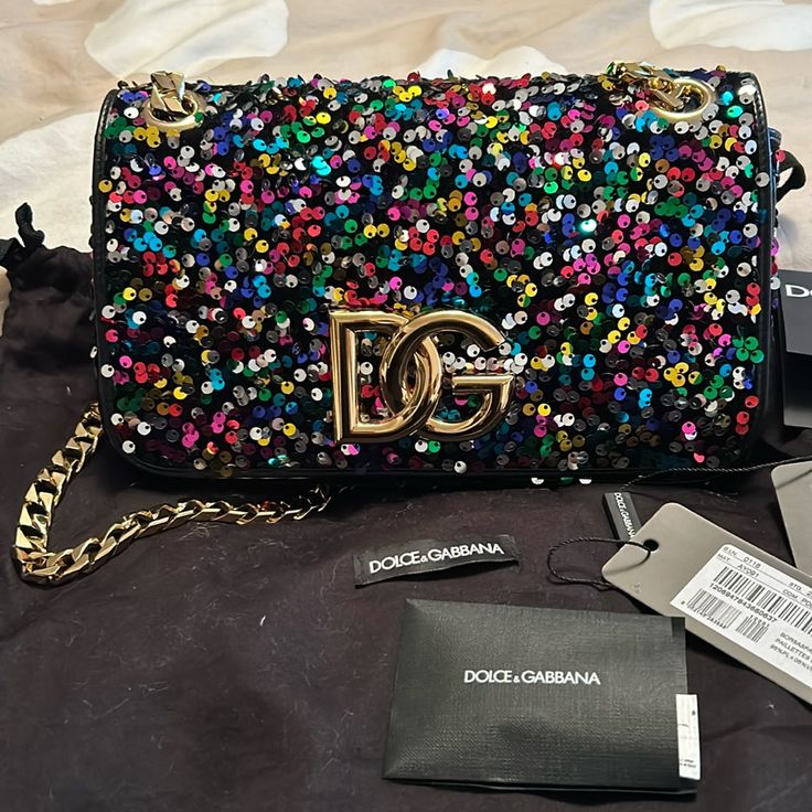 Beautiful Multicolor Sequin Shoulder Bag. The Chain Can Be Pulled Out To Create A Crossbody. I Had To Have This Bag, Then Never Used It. She Deserves To Be Shown Off. Brand New With Tags And All Of Her Filler. She’s Been Sitting In Her Dust Bag On My Shelf For Almost A Year. She Is Sold Out Everywhere Because She Such A Pretty Lady 10 1/2” Long X 6” Tall X 2” Deep Luxury Multicolor Bags With Detachable Strap, Luxury Multicolor Crossbody Bag, Multicolor Crossbody Shoulder Bag For Party, Elegant Multicolor Shoulder Bag With Detachable Strap, Elegant Multicolor Crossbody Shoulder Bag, Designer Party Bags With Chain Strap, Luxury Purple Shoulder Bag With Chain Strap, Designer Purple Shoulder Bag For Evening, Designer Purple Evening Bags