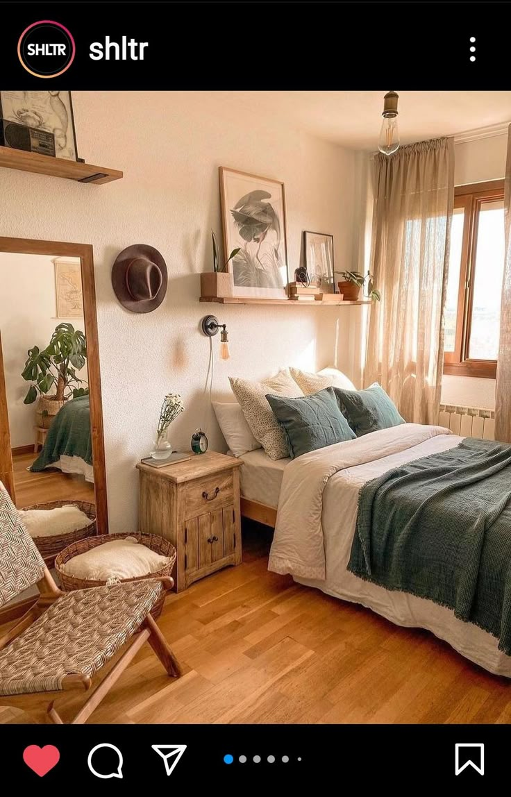 a bed room with a neatly made bed next to a chair and a large window