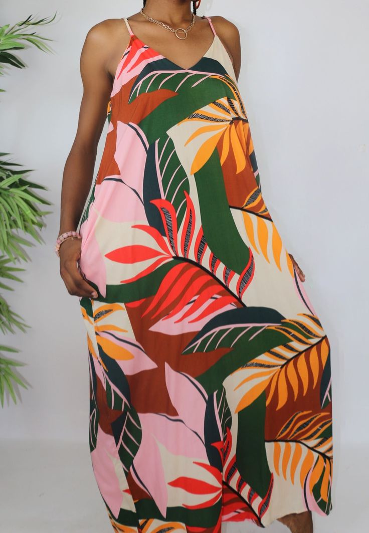 This beautiful maxi dress will have you looking and feeling your best. The tropical leaves print makes for a fun and flirty look that says "relaxation". The adjustable straps are a simple but stylish feature that ensure the perfect fit. Pair this dress with a pair of sandals for a comfortable stroll or with heels and a chain belt to create a summer party look. Made of Rayon. Tropic Island, Beautiful Maxi Dresses, Tropical Leaf Print, Leaves Print, Party Look, Chain Belt, Tropical Islands, Party Looks, Tropical Leaves