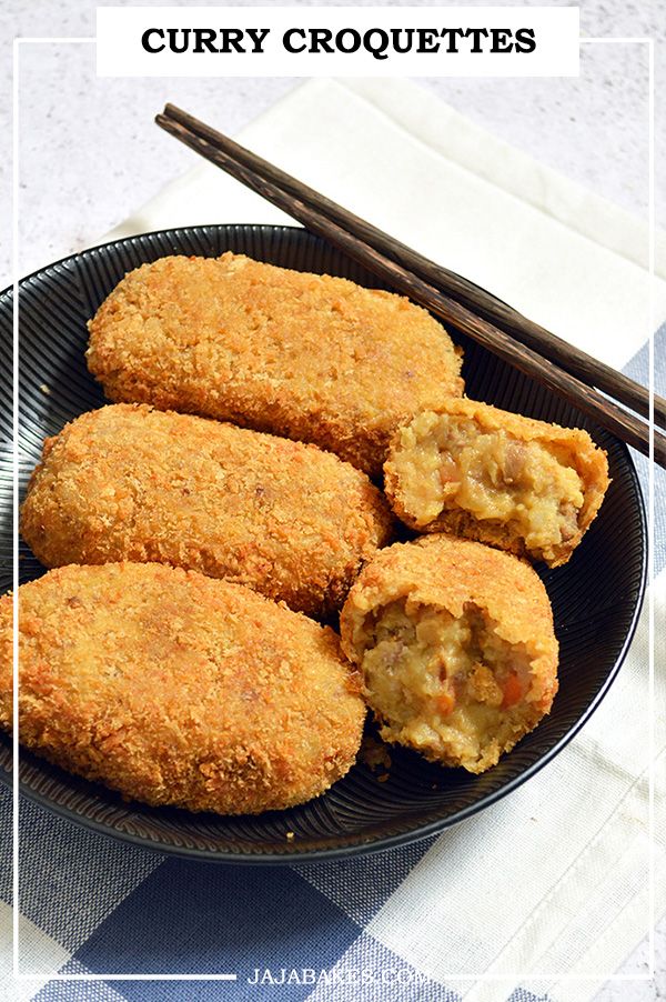 some fried food on a plate with chopsticks next to it and the words curry croquettes