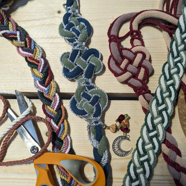 several different types of rope and scissors on a table