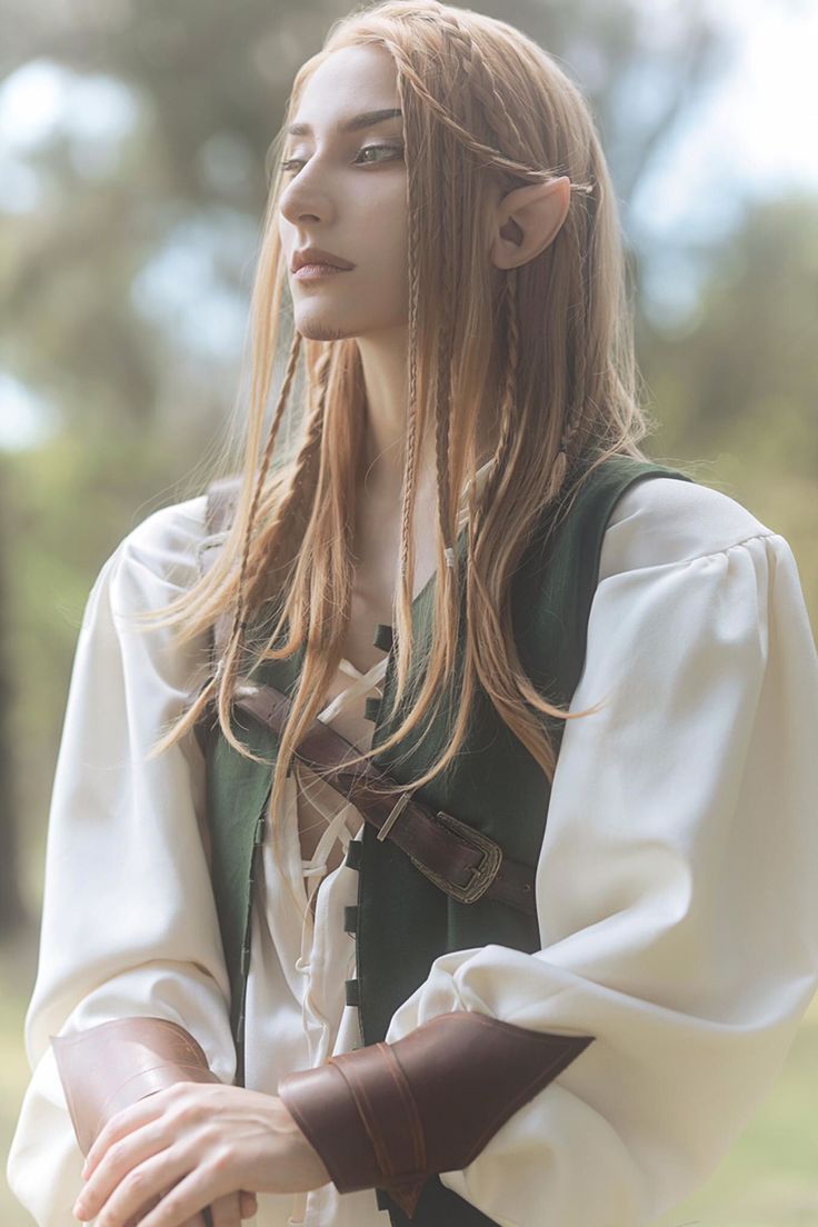 a woman with long hair wearing a costume