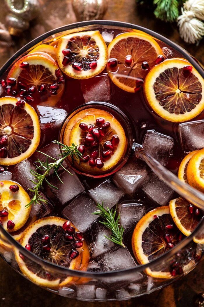 a glass bowl filled with blood oranges and ice