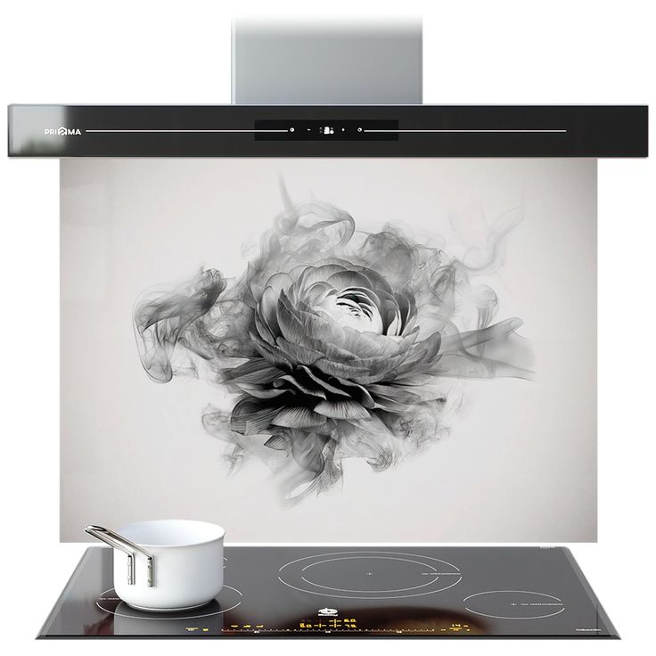 a black and white photo of a rose on the wall above a stove top oven