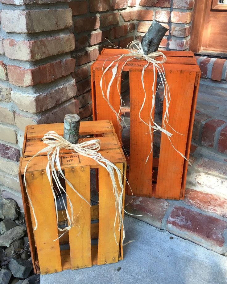 two wooden crates sitting next to each other