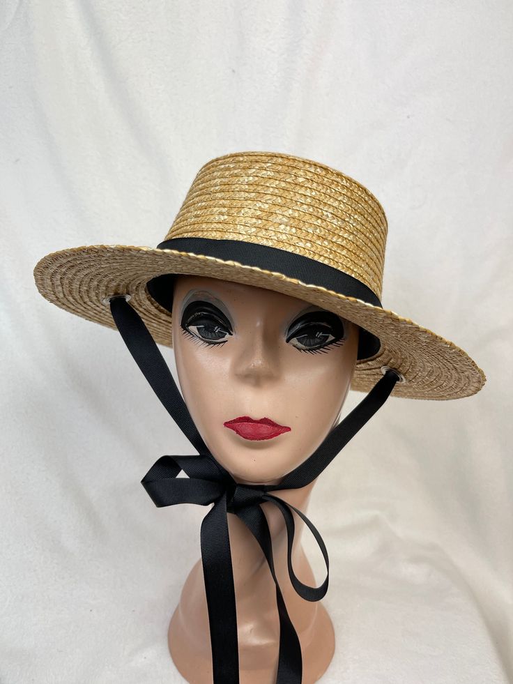 This natural wheat straw 2. 7/8-inch brim boater hat has a black grosgrain ribbon band and an under the chin tie. The hat has a cord inside to tighten the head size if needed and will fit up to a 22 5/8 inch head size. The hat is made from Milan braid natural wheat sewn straw. I can change the ribbon color, please see the color chart in the last photo. Let me know at checkout in the notes section which color ribbon you would like. The ribbon is removable. NOTE: Please check the head size before purchase, I am happy to answer any questions you may have. There will be a 20% restocking fee for all returned hats. #1  White #2 Black #3 Light Pink #4  Denim Blue #5 Navy Blue #7  Mauve #8  Hot Pink #9  Lavender #10 Purple #11  Champagne #12  Butter Yellow #13  Brown #14  Sage Green #15  Olive Gre Adjustable Straw Boater Hat For Country Events, Adjustable Straw Hat With Ribbon For Kentucky Derby, Straw Hat With Ribbon And Short Brim, Adjustable Top Hat For Summer Country Events, Summer Adjustable Top Hat For Country Events, Adjustable Wide Brim Straw Hat With Ribbon, Adjustable Brimmed Boater Hat With Ribbon, Adjustable Boater Hat With Ribbon And Short Brim, Vintage Adjustable Top Hat For Summer