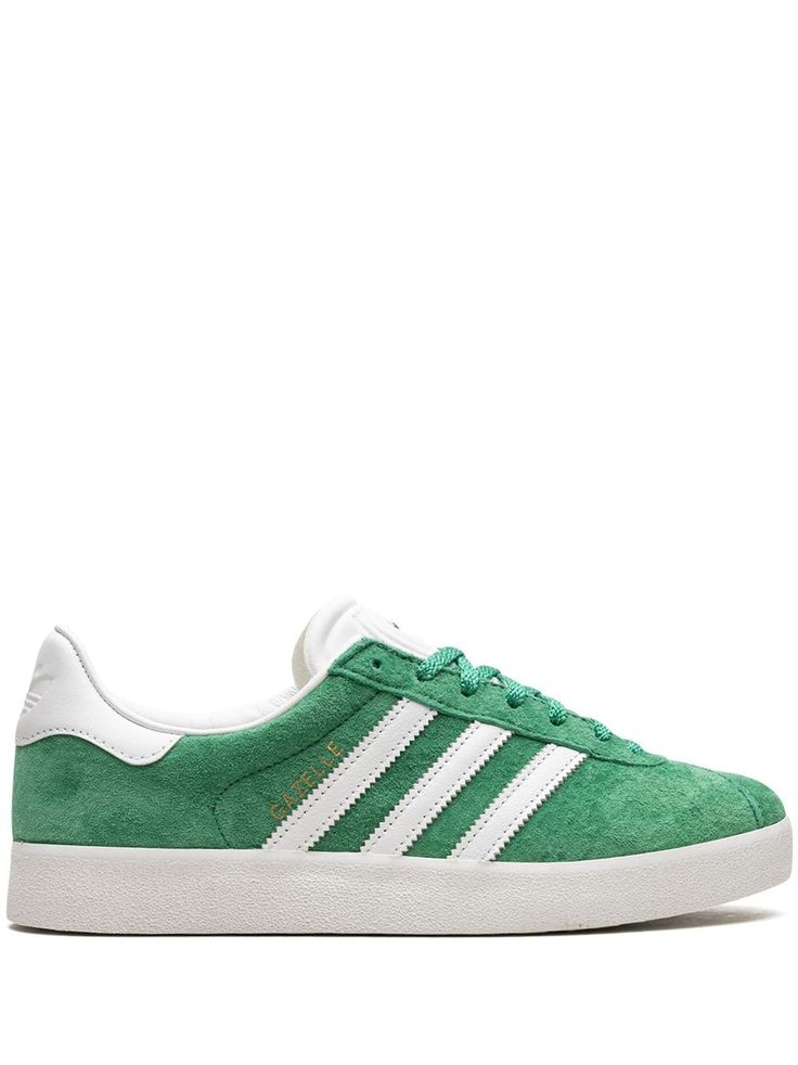 green suede/leather logo print to the side signature 3-Stripes logo contrasting heel counter round toe front lace-up fastening logo-debossed tongue branded insole rubber sole These styles are supplied by a premium sneaker marketplace. Stocking only the most sought-after footwear, they source and curate some of the most hard to find sneakers from around the world. Shoes Sneakers Adidas, Green Suede, Adidas Gazelle, Suede Sneakers, Leather Logo, Signature Style, Adidas Shoes, Logo Print, Womens Shoes Sneakers