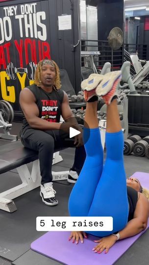 a man and woman doing exercises in the gym with their feet up on each other