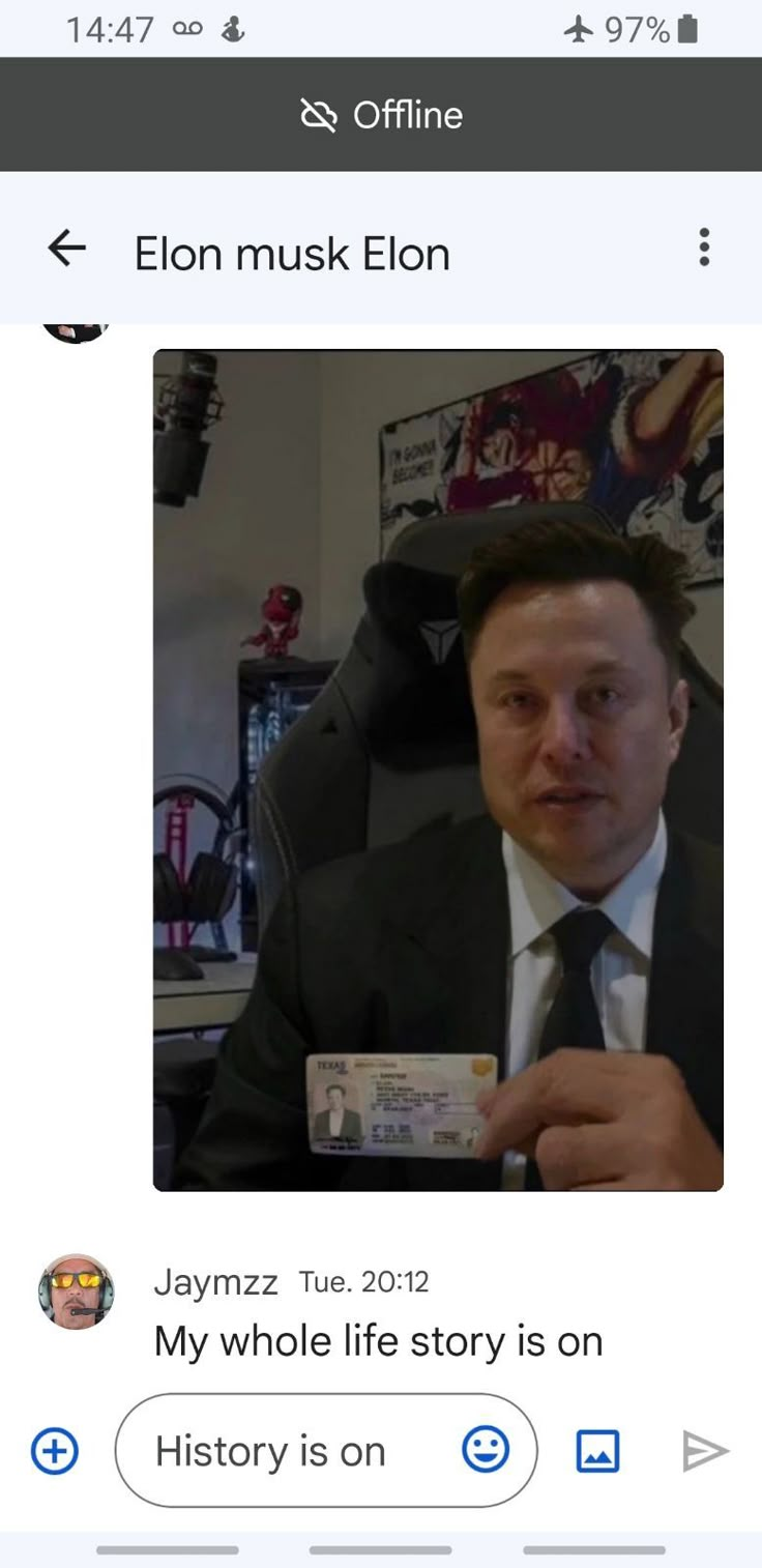 a man in a suit and tie holding up a small card with the caption'my whole life story is on history is on '